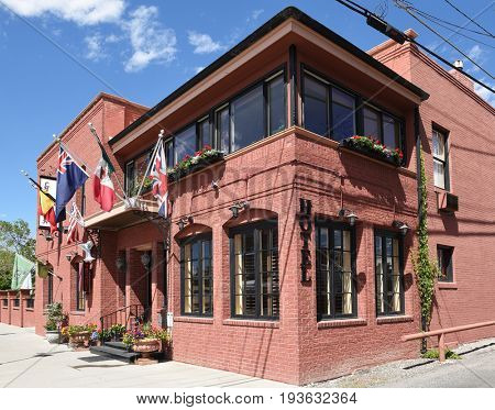 CODY, WYOMING - JUNE 24, 2017: The Chamberlin Inn. the historic hotel and landmark, has 21 units made up of a series of suites, rooms, cottage and garden studios. 