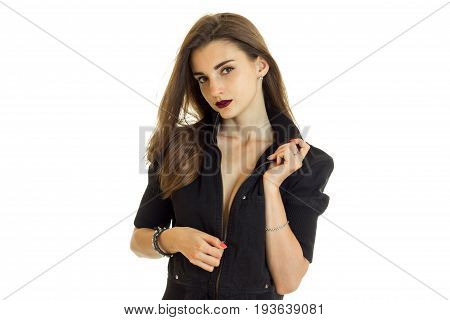 Portrait of sexual brunette in a black jacket and dark lipstick on lips isolated on white background
