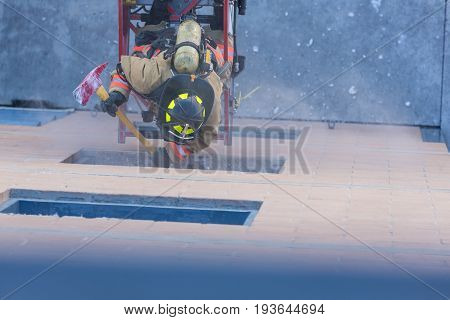 Firefighter Training Entering And Exiting A Building On A Truck Ladder Overhead View