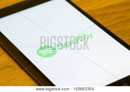 SARANSK, RUSSIA - JULY 02, 2017: A Smartphone screen shows logo of Spotify. Selective focus.