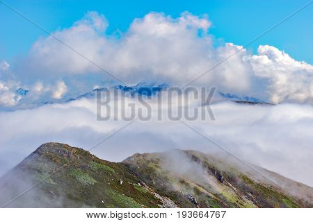 Clouds cover the mountain tops. Caucasus. Russia.