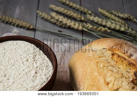 Homemade Baked Bread Flour And Wheat On Light Wooden Background