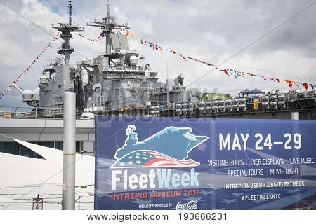 Ship Tour USS Kearsarge (LHD 3) Wasp-class amphibious assault ship: Fleet Week sign at the Intrepid Sea, Air & Space Museum on Pier 86N. Fleet Week NEW YORK MAY 25 2017.
