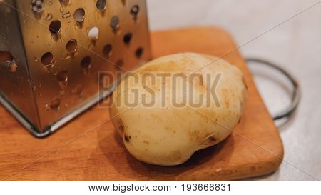 A Grater For Rubbing Vegetables And Potatoes Close-up. Preparation Of Ukrainian Deruns. Recipe For T