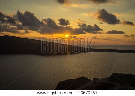 Image of sunset from viewpoint in Oia on Santorini island in Greece