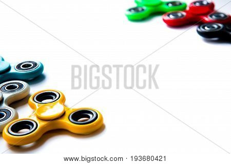 Fidget finger spinner anxiety relief toy on white isolated background copyspace. Concept relieving stress
