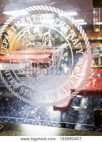 Ship Tour USS Kearsarge (LHD 3) Wasp-class amphibious assault ship: Department of the Navy emblem etched on plexiglass divider in mess hall. Fleet Week NEW YORK MAY 25 2017.