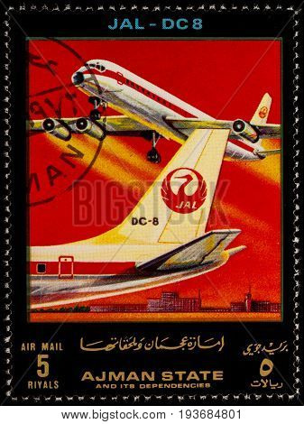 Moscow Russia - July 03 2017: A stamp printed in Ajman shows passenger airliner Douglas DC-8 JAL series "Modern Passenger Airplanes" circa 1972