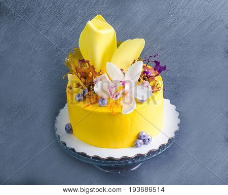 yellow cream cheese cake with chocolate twist and isomalt decoration