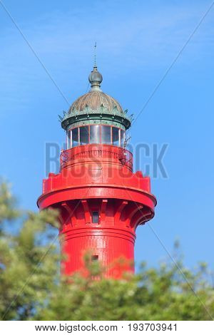 Top of cast iron lighthouse red and white at the French west beach