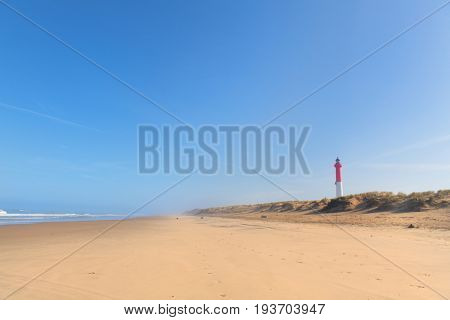 Lighthouse red and white at the French west beach