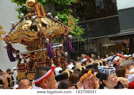 2017 05 28. SHINJUKU TOKYO JAPAN. People are carrying a portable shrine on their shoulders and walking around shinjuku city. known as OMIKOSHI MASTURI FESTIVAL at HANAZONO JINJA, SHINJUKU TOKYO JAPAN
