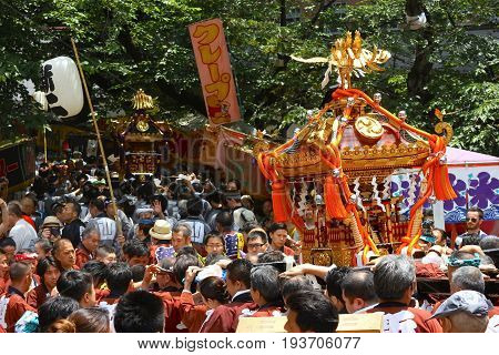 2017 05 28. SHINJUKU TOKYO JAPAN. People are carrying a portable shrine on their shoulders and walking around shinjuku city. known as OMIKOSHI MASTURI FESTIVAL at HANAZONO JINJA, SHINJUKU TOKYO JAPAN