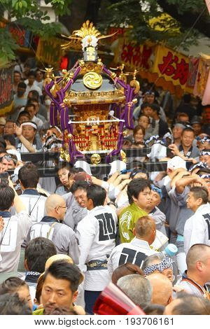 2017 05 28. SHINJUKU TOKYO JAPAN. People are carrying a portable shrine on their shoulders and walking around shinjuku city. known as OMIKOSHI MASTURI FESTIVAL at HANAZONO JINJA, SHINJUKU TOKYO JAPAN