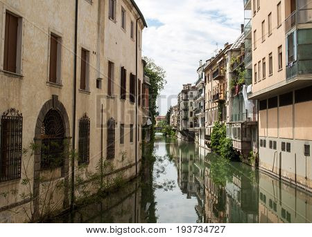 The city canal San Massimo runs among residential houses in the centre of the old city Padua Veneto Italy