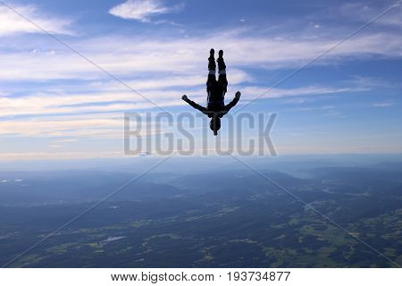 Skydiving over beautiful Norway. Clouds, sun and sky