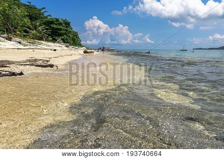 Tropical beach background and wonderful nature landscape with sandy beach with beautiful coral in Rusukan Besar island,Labuan,Malaysia.