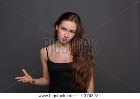 Tough girl. Angry woman raise hand about to slap. Upset girl ready to fight and quarrel, looking at camera