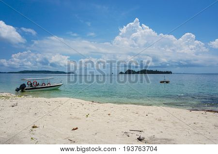 Labuan,Malaysia-May 1,2017:Tropical beach background and wonderful nature landscape with sandy beach & tourist boat in Rusukan Besar island,Labuan,Malaysia.