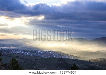Overview of the Guadalupe town during a foggy sunrise Caceres Spain