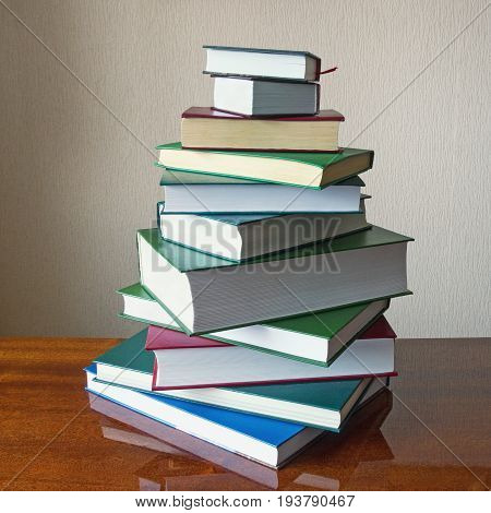 Stack of different books on the table.