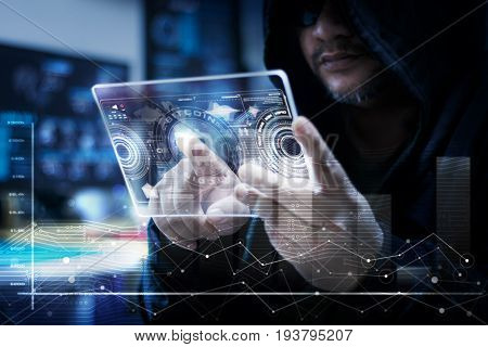 Hacker using clear tablet with HUD panel and bitcoin code graph bar data analytsis element for cyber technology concept dark and grain process shallow depth of field select focus on hands