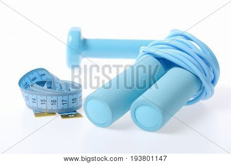 Measuring Tape In Blue Placed In Roll Near Skipping Rope