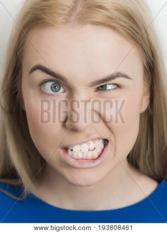 Woman Squinting Eyes On Silly Face