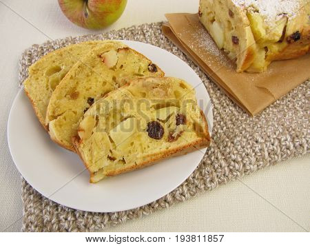 Sponge cake with apple pieces and raisins