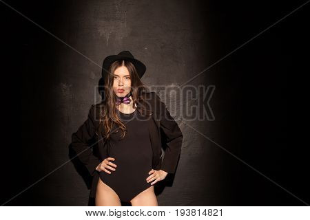 sexy girl in underwear and jacket is black wall 