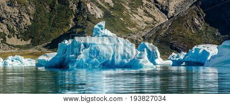 Small and blue iceberg near the coast Greenland