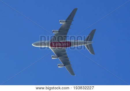 Almere, The Netherlands - July 3, 2017: Emirates Airbus A380-800 (A6-EDR) flies above the city of Almere.