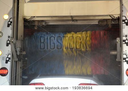 Car is washed in car washing machine