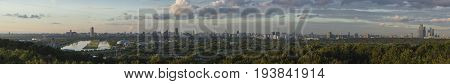 Panoramic view of Moscow from Krylatskoye District. Olympic Rowing canal, Moscow-city. Sunset time.