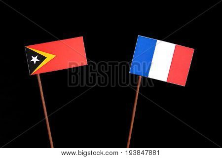 East Timorese Flag With French Flag Isolated On Black Background