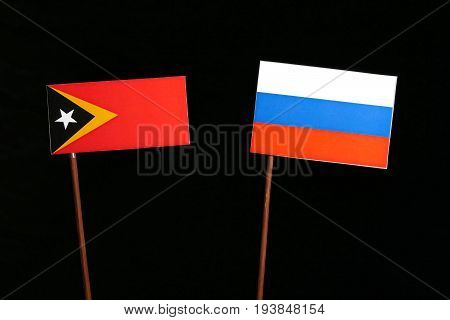 East Timorese Flag With Russian Flag Isolated On Black Background