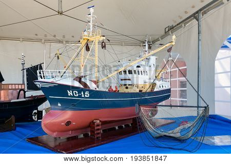 URK THE NETHERLANDS - MAY 27 2017: Scale model of fishing vessel at harbor of Urk during a local fishing day event