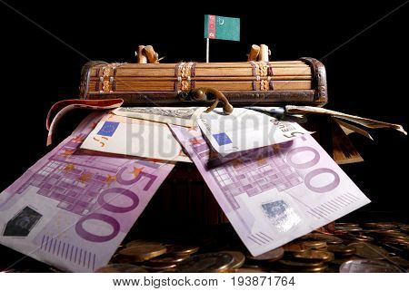Turkmenistani Flag On Top Of Crate Full Of Money