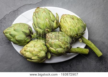 Fresh Artichoke On White Plate. Harvest Concept. Copy Space