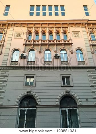 An old very beautiful multi-storey house with carved facade from the bottom in Lviv Ukraine