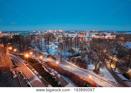 Tallinn, Estonia - December 4, 2016: Old Stone Staircase And Cityscape At Winter Evening Night. View From Patkuli Viewpoint.