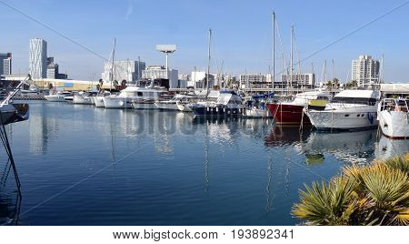 Ships sailboats yachts tied in the port