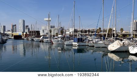 Ships sailboats yachts tied in the port