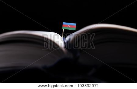 Azebaijan Flag In The Middle Of The Book. Knowledge And Education Concept.
