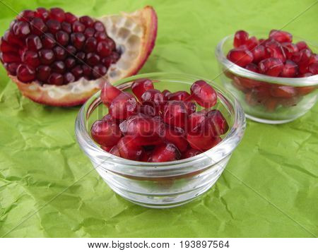 Fresh raw pomegranate seeds in a little bowl