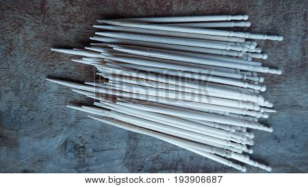 tooth picks abstract composition on wood background