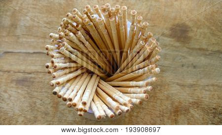 abstract wooden tooth picks on wood background