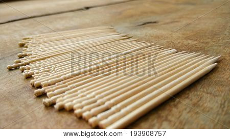 tooth picks abstract composition background in wood