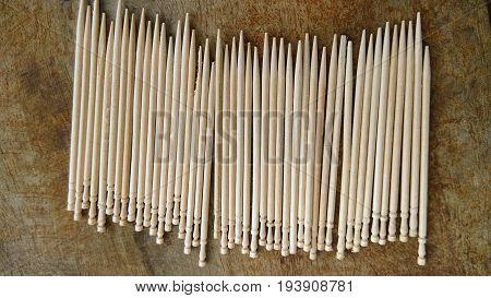 tooth picks abstract composition background in wood