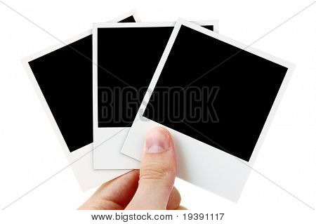 Руку холдинга три пустые фотографии
